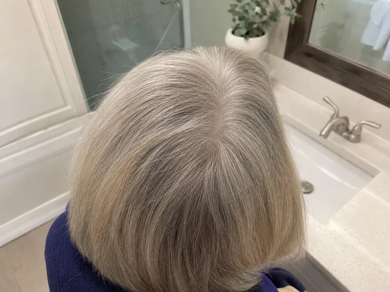 Dorothy W. blonde gray bathroom part coverage after using Standora hair density powder